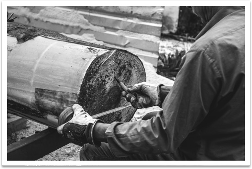 A logger classifying a log at the mill